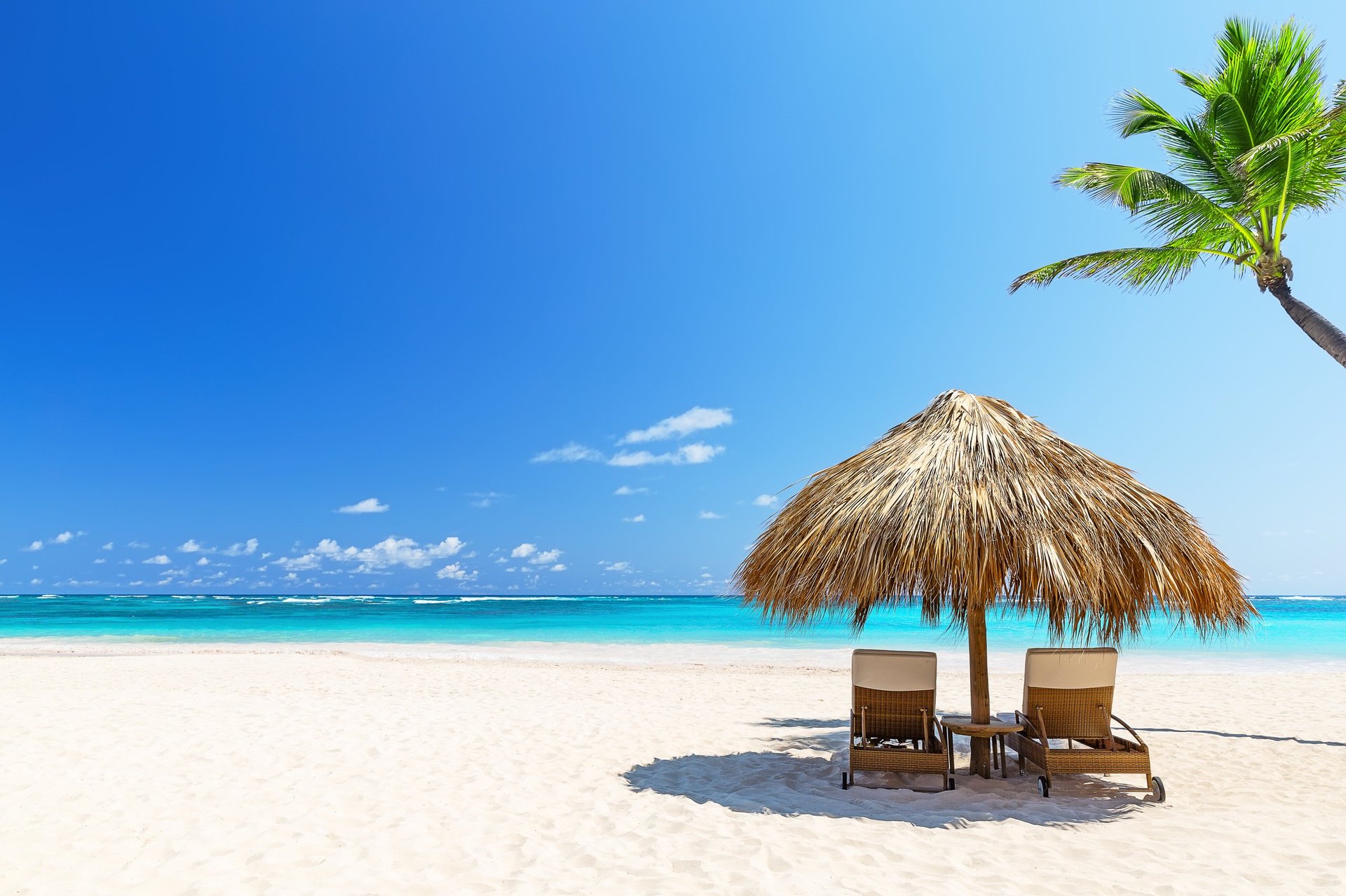 Caribbean beach vacation paradise with beach chairs