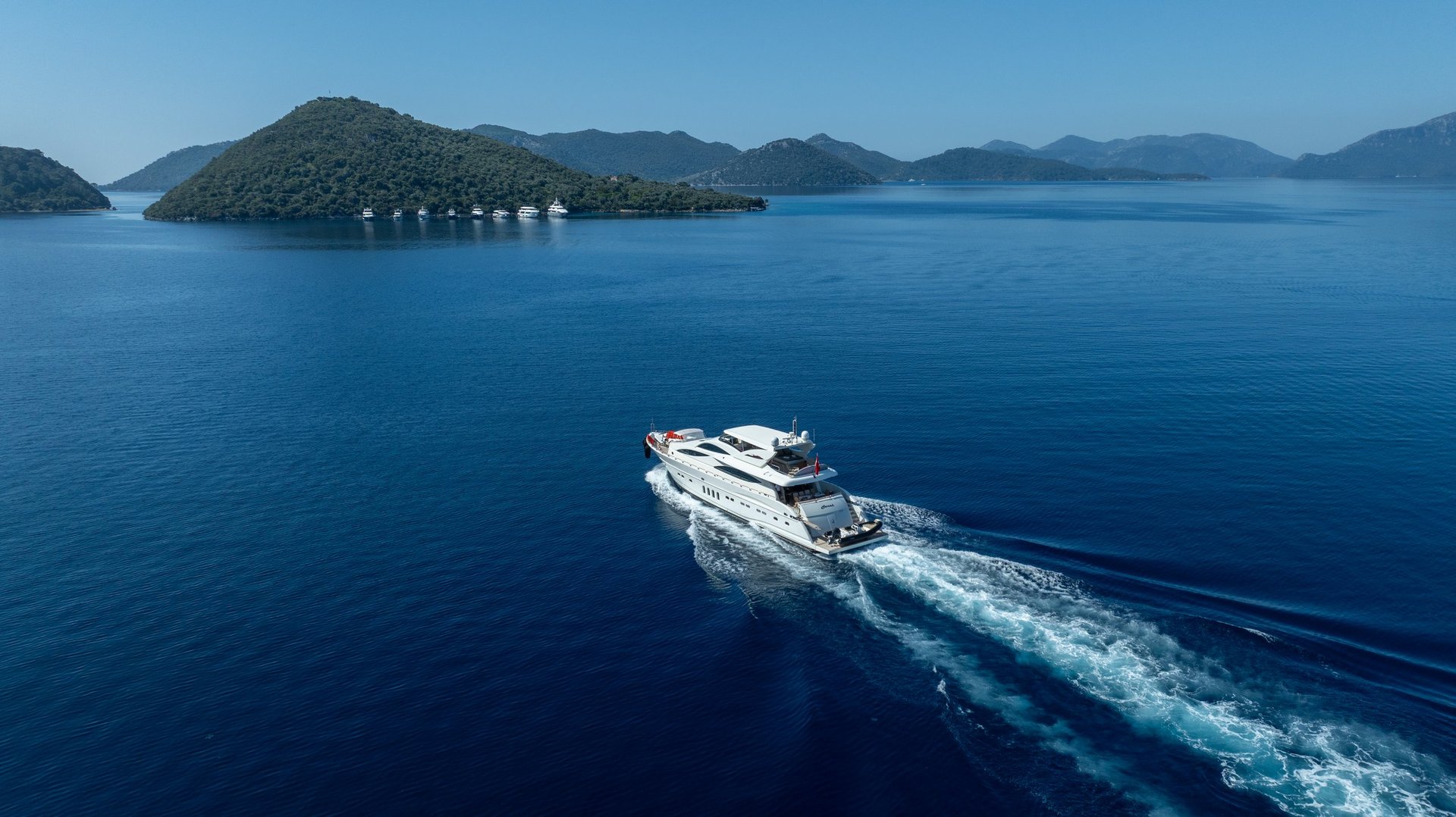 Fethiye, Muğla, TURKEY – September 9, 2025: A premium white yacht cruising smoothly across deep blue waters