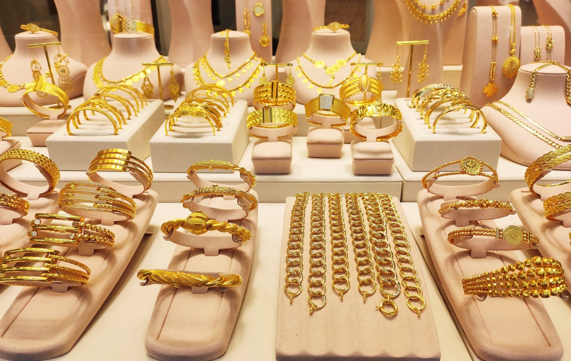 Luxury gold jewelry display in a boutique window